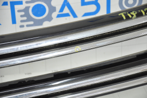 Grille cover with VW Tiguan 12-18 badge, rest bumps and sand on chrome
