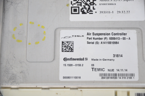 Tesla Model S 12-15 pre-restoration air suspension control unit dent