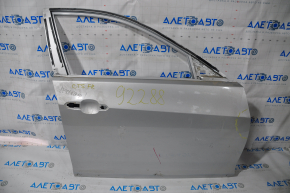 The front right door of a Cadillac CTS 14-19 is bare, with a dent near the hinges, silver.