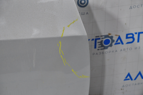 The front right door of a Cadillac CTS 14-19 is bare, with a dent near the hinges, silver.