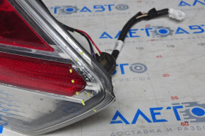 Light outer wing right Nissan Rogue 14-16 water damage, chipped corner