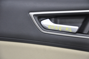 Door trim card rear left Ford Edge 15-18 black leather with beige insert plastic turned white, trim is worn