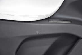 Door trim card front left Tesla Model X 16-21 black with white, molding wood, tear and pokes on leather, scratches and burrs on molding, broken fastener