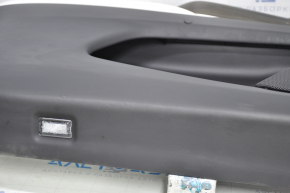 Door trim card front left Tesla Model X 16-21 black with white, molding wood, tear and pokes on leather, scratches and burrs on molding, broken fastener