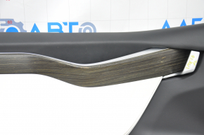 Door trim card front left Tesla Model X 16-21 black with white, molding wood, tear and pokes on leather, scratches and burrs on molding, broken fastener