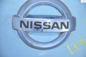 Front cover of charging port nose Nissan Leaf 13-17 with badge, dented, cracks, badge rubbed off
