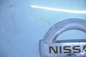 Front cover of charging port nose Nissan Leaf 13-14 under camera, with badge, dented, scratches, crack, badge rubbed off