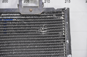 The air conditioning condenser radiator of a Toyota Corolla e12 02-06 is crushed, and the honeycombs are falling out.