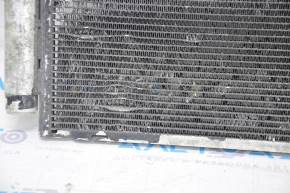 The air conditioning condenser radiator of a Toyota Corolla e12 02-06 is crushed, and the honeycombs are falling out.