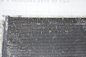 The air conditioning condenser radiator of a Toyota Corolla e12 02-06 is crushed, and the honeycombs are falling out.