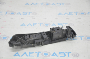 Left rear bumper mount under the headlight for a 1995 Ford Edge (pre-restored)