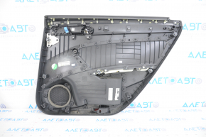 Door trim card rear left VW Passat b7 12-15 USA black with black insert plastic, armrest leather, molding gray gloss, pressed, scratches