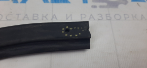 The rear left lower door seal is torn on a Subaru XV Crosstrek 13-17