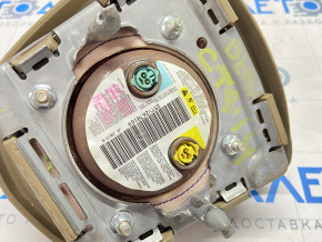 Airbag in the driver's steering wheel of a 1920s Cadillac CTS pre-restoration, beige, shot