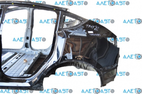 Quarter wing rear left Tesla Model Y 21- on the body, cast side member, black PBSB, bump on the threshold, scratch