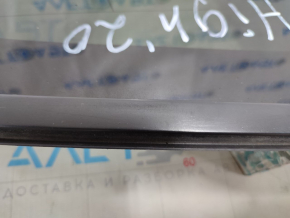 Window blind glass rear left Toyota Highlander 20- tinted, scratch on edge, scratch on chrome, contacts torn off