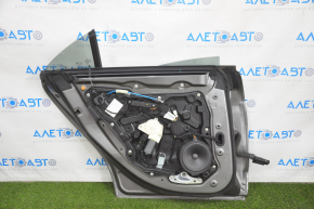 Door assembly rear left Mercedes CLA 14-19 keyless, graphite 787, with speaker (Harman/Kardon), dented, bumps