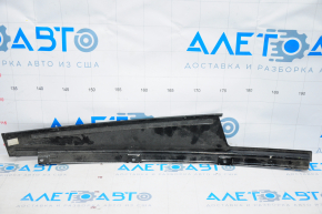 The front right side door trim panel on a 1993 Dodge Dart is worn out.