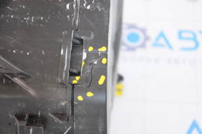 The Jeep Compass 17-26 underhood fuse box is cracked.