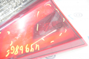 Light inside trunk lid left Nissan Rogue 17- scratches