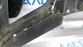 The front bumper lip of the VW Tiguan 18-24 is worn out and dented