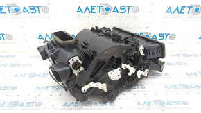 The bare air conditioner housing, left side of a Toyota Camry v40.