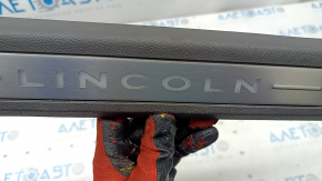 Door sill trim inner front right Lincoln Nautilus 19-23 brown with chrome and backlight, scratches