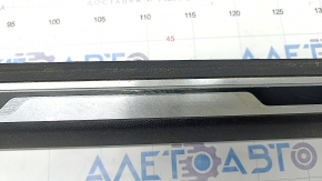 Door sill trim left VW Jetta 19- black with chrome molding and backlight, scratches