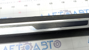 Door sill trim left VW Jetta 19- black with chrome molding and backlight, scratches