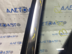 Window blind glass rear left VW Passat b8 16-19 USA chrome, scratches on chrome, tear of seal