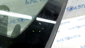 Window blind glass front left Lexus Hs250h 10-12 scratches on chrome, scratch on glass