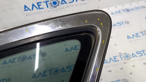 Window blind glass rear left Mazda CX-7 06-09 scratches on glass, scratches on chrome, tear of seal