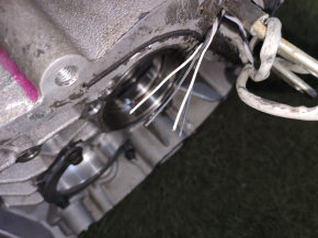 Rear electric motor housing left Tesla Model S 12-15 pre-restoration, under the rotor, broken chip
