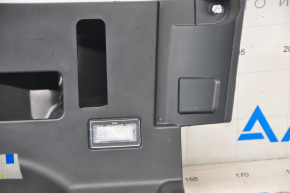 Tesla Model S 12-20 driver's footwell lower dashboard trim is worn, pokes