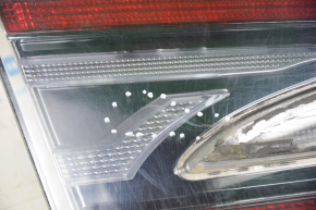 Light inside trunk door left Tesla Model S 12-20 scratches, dirt under glass