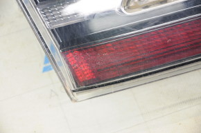 Light inside trunk door left Tesla Model S 12-20 scratches, dirt under glass