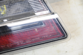 Light inside trunk door left Tesla Model S 12-20 scratches, dirt under glass