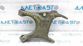 The lower rear right transverse control arm of a BMW X5 F15 14-18 has a torn silent block and broken bolt.