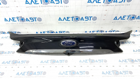 Ford Edge 19 trunk lid trim with chrome molding and emblem, scratches