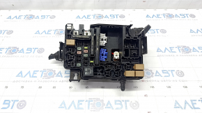 Underhood fuse box Kia Forte 20-21 under automatic transmission, halogen headlights
