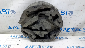 Foam plastic under the Chevrolet Malibu 16 tool is torn, dented