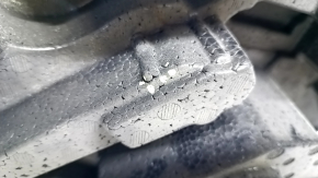 Foam plastic under the Chevrolet Malibu 16 tool is torn, dented