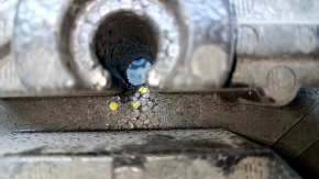 Foam plastic under the Chevrolet Malibu 16 tool is torn, dented