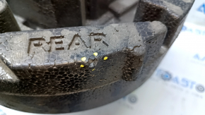Foam plastic under the Chevrolet Malibu 16 tool is torn, dented