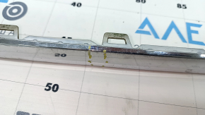 Molding rear bumper center VW Tiguan 18- chrome, dented, cracks, broken mount