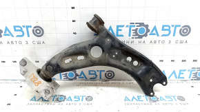 The lower front right control arm of a VW Tiguan 09-17 is rusty.