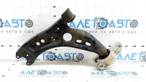 The lower front left control arm of a VW Tiguan 09-17 is rusty.