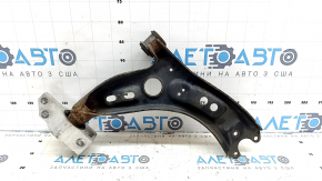 The lower front left control arm of a VW Tiguan 09-17 is rusty.