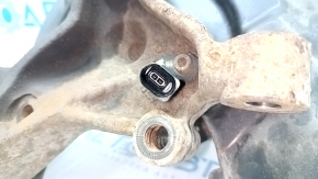 Trunnion with hub rear left VW Passat b8 16-19 USA with casing, with ABS sensor, rusty