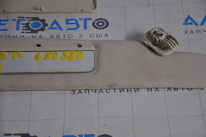 Right visor Tesla Model S 12-20 base, beige, cracked mount, chemically treated, broken lid fasteners